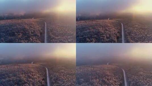 航拍冬季山林雾凇晨雾朝阳高清在线视频素材下载