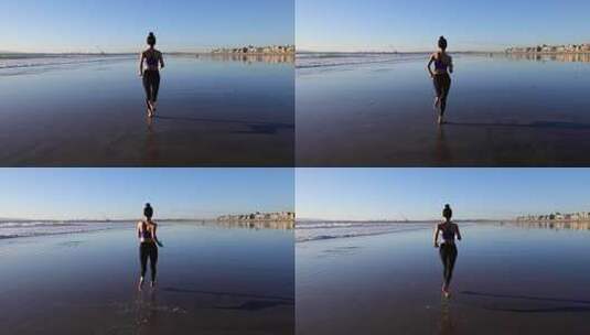 女人在海边慢跑高清在线视频素材下载