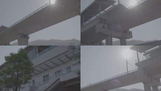 阳光下汽车行驶仰拍高铁动车站轨道慢镜头高清在线视频素材下载