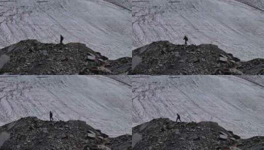 航拍攀登川西贡嘎山卫峰乌库楚雪山的登山者高清在线视频素材下载