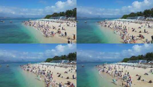 航拍俯视海南三亚白沙滩上旅游度假的游客高清在线视频素材下载