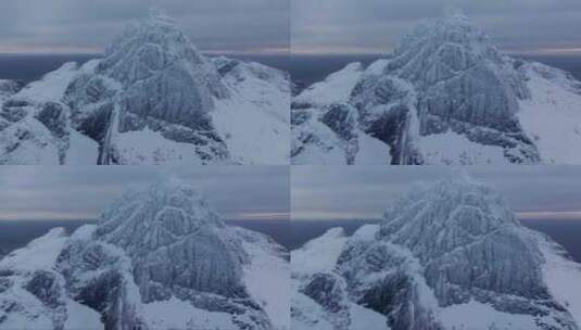 体验探索冰雪覆盖的山峰悬崖和岩石的刺激高清在线视频素材下载