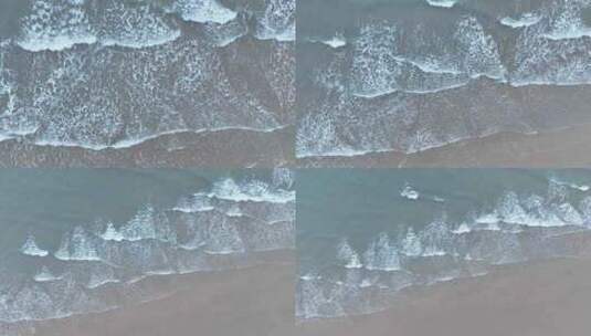 俯拍海浪拍打沙滩海水拍打岸边俯视潮水浪花高清在线视频素材下载