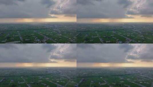 航拍平原地区局部下雨暴雨雨幕夕阳乌云高清在线视频素材下载