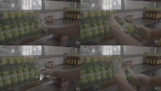 工人操作调味瓶生产流水线高清在线视频素材下载