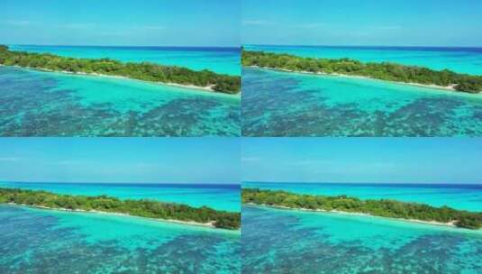 白天飞越白色天堂海滩和水蓝色水背景的岛屿景观高清在线视频素材下载
