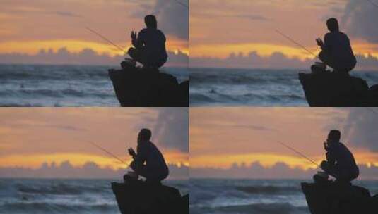 夕阳下渔民剪影的手持长镜头高清在线视频素材下载