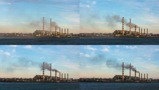 从河边的发电厂冒出的烟高清在线视频素材下载