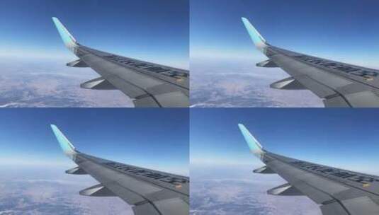 飞机舷窗拍摄飞机空中飞行画面高清在线视频素材下载