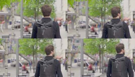 男人背着包在街头行走高清在线视频素材下载