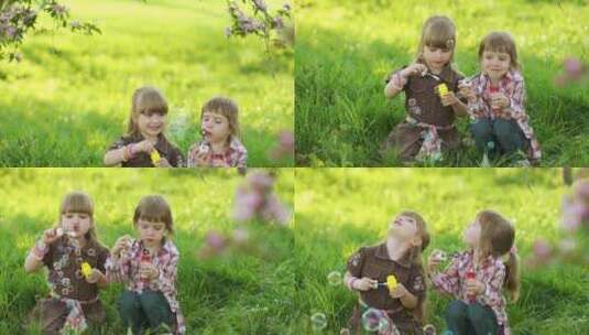 两个小女孩在草地上吹泡泡高清在线视频素材下载