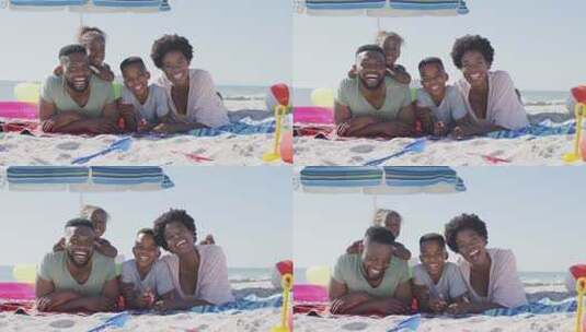 黑人家庭躺在海滩上大笑的视频高清在线视频素材下载