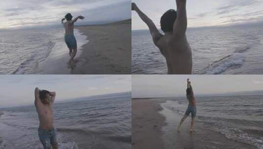 男舞者在海滩上舞动高清在线视频素材下载