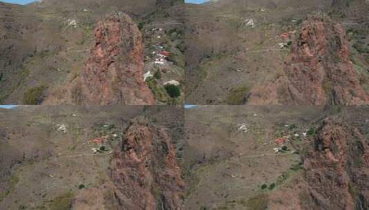 航拍大红岩后的小山村高清在线视频素材下载