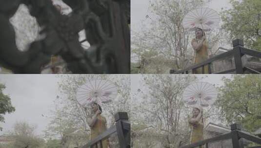 园林里打着油纸伞的人高清在线视频素材下载