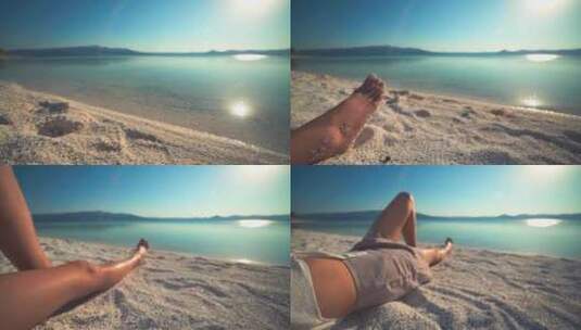 一名女孩躺在沙滩上晒日光浴高清在线视频素材下载