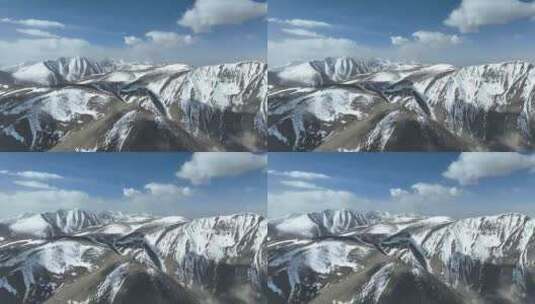 航拍蓝天白云下的新疆喀什地区雪山风光高清在线视频素材下载
