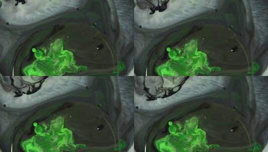 绿色和黑色丙烯酸化学反应。慢动作。高清在线视频素材下载