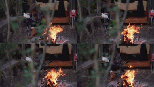 女人在森林小木屋火堆前高清在线视频素材下载