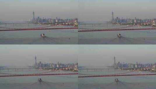 武汉江滩航拍旁晚鹦鹉洲大桥船江面高楼高清在线视频素材下载