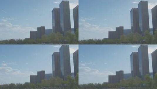 飞机掠过城市上空高清在线视频素材下载