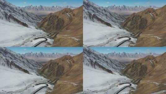 航拍新疆塔县帕米尔高原盘龙古道雪山公路高清在线视频素材下载