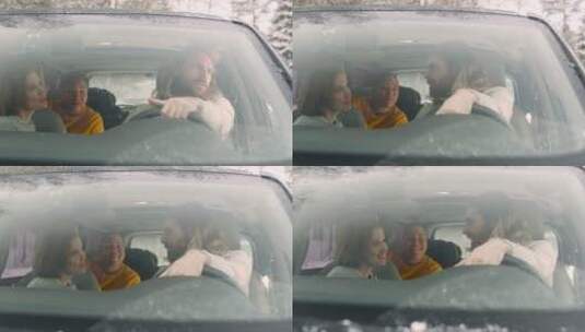 雪中坐在车里聊天的朋友高清在线视频素材下载