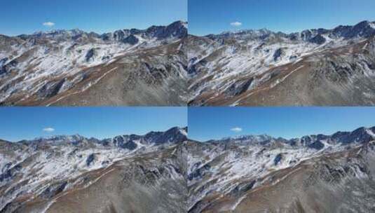 蓝天下的雪山山脉航拍高清在线视频素材下载