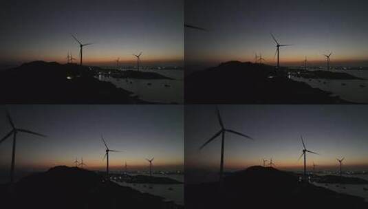 夜晚海边风车航拍大海夜景自然风光晚上风景高清在线视频素材下载