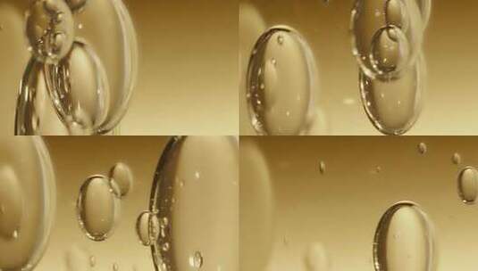 微距拍摄透明水珠水泡在黄色背景下漂浮高清在线视频素材下载