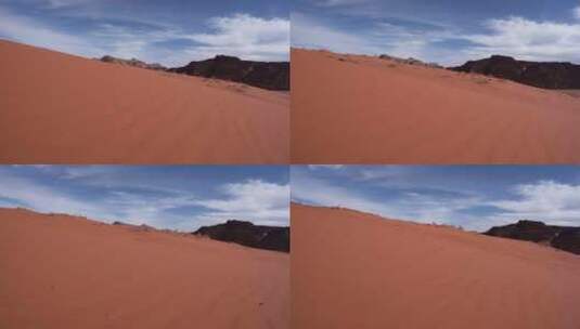 从沙丘下山看到的山脉和沙草高清在线视频素材下载