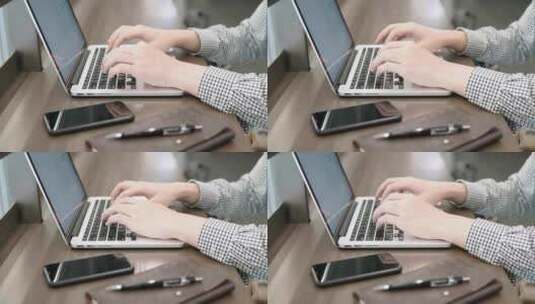 男人在用笔记本电脑打字特写高清在线视频素材下载