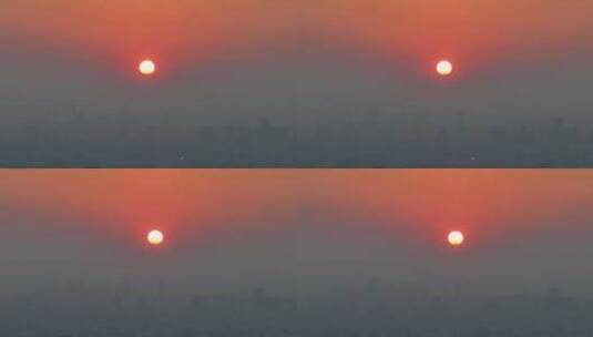 城市上空的火红色的太阳落日高清在线视频素材下载