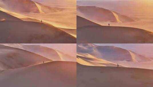 航拍新疆沙漠徒步（库木塔格沙漠）高清在线视频素材下载