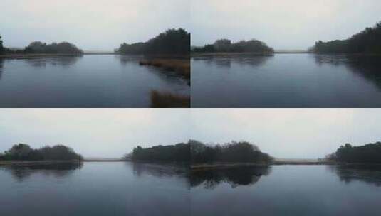 航拍日落余晖下的湖泊河道高清在线视频素材下载