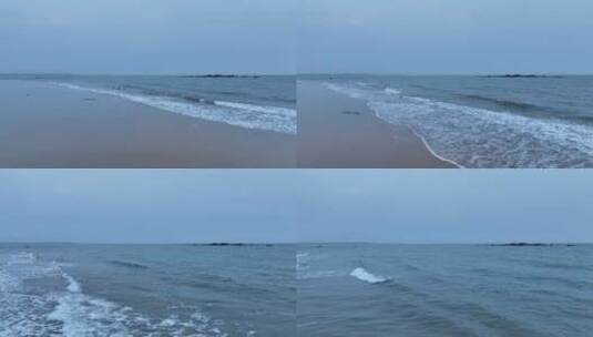 阴天大海沙滩航拍海岸海水拍打沙滩海浪潮水高清在线视频素材下载