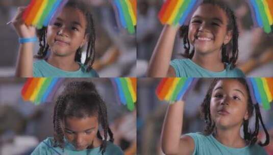微笑的女孩在窗格上画彩虹高清在线视频素材下载