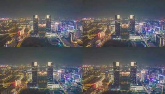 河南郑州绿地双子塔火车东站夜景航拍高清在线视频素材下载