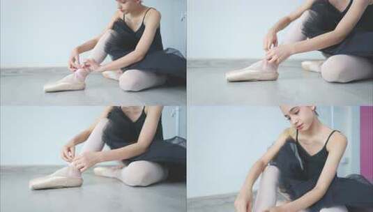 芭蕾舞女学生，在地板上穿芭蕾舞鞋，准备在高清在线视频素材下载