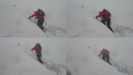 风雪中攀登四川贡嘎山区贡巴峰的登山者高清在线视频素材下载