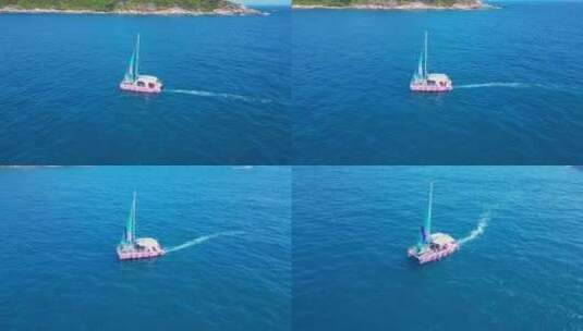海南三亚高视角航拍海洋大海与行驶的帆船高清在线视频素材下载