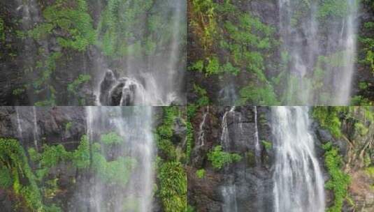 从瀑布上方的郁郁葱葱的热带雨林岩石表面上高清在线视频素材下载