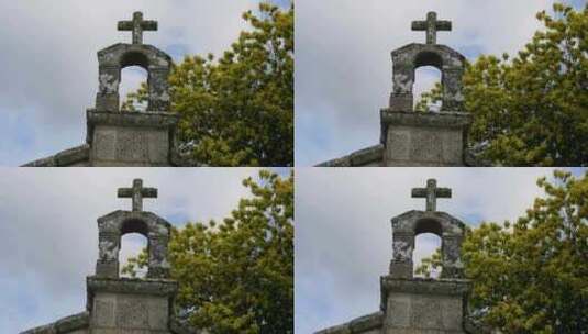 低角度仰望S教堂雕刻的石头十字架、苔藓地高清在线视频素材下载
