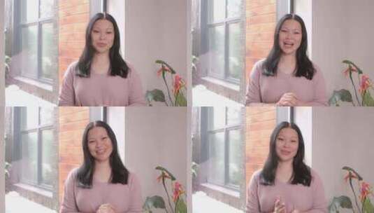 自信可爱的中年亚洲女人在室内录制视频内容高清在线视频素材下载