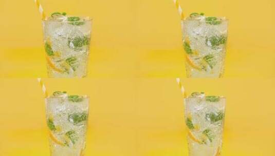 玻璃杯的柠檬水被水泼的高速瞬间高清在线视频素材下载