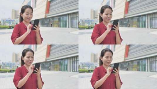 亚洲东方中国女性在商场内玩手机沟通联系高清在线视频素材下载