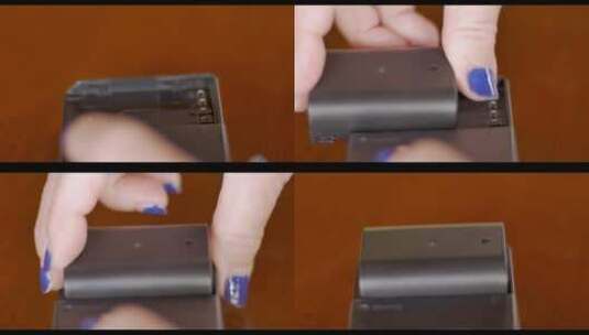 女人的手将锂离子电池附在充电器上-特写高清在线视频素材下载