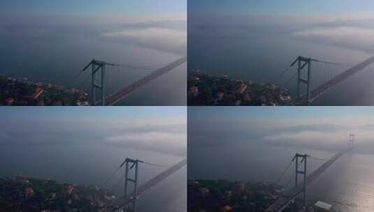 土耳其伊斯坦布尔雾天博斯普鲁斯海峡大桥的航拍视频。7月15日烈士桥高清在线视频素材下载