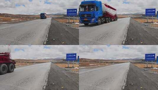 青藏高原青藏公路通过昆仑山口的货运卡车高清在线视频素材下载