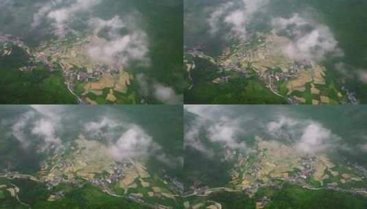 航拍云海下的山脉乡村小镇高清在线视频素材下载